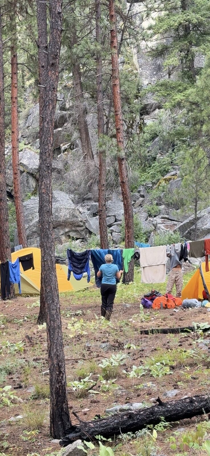 Wet rafting gear drying around camp during rainy weather on the Main Salmon River