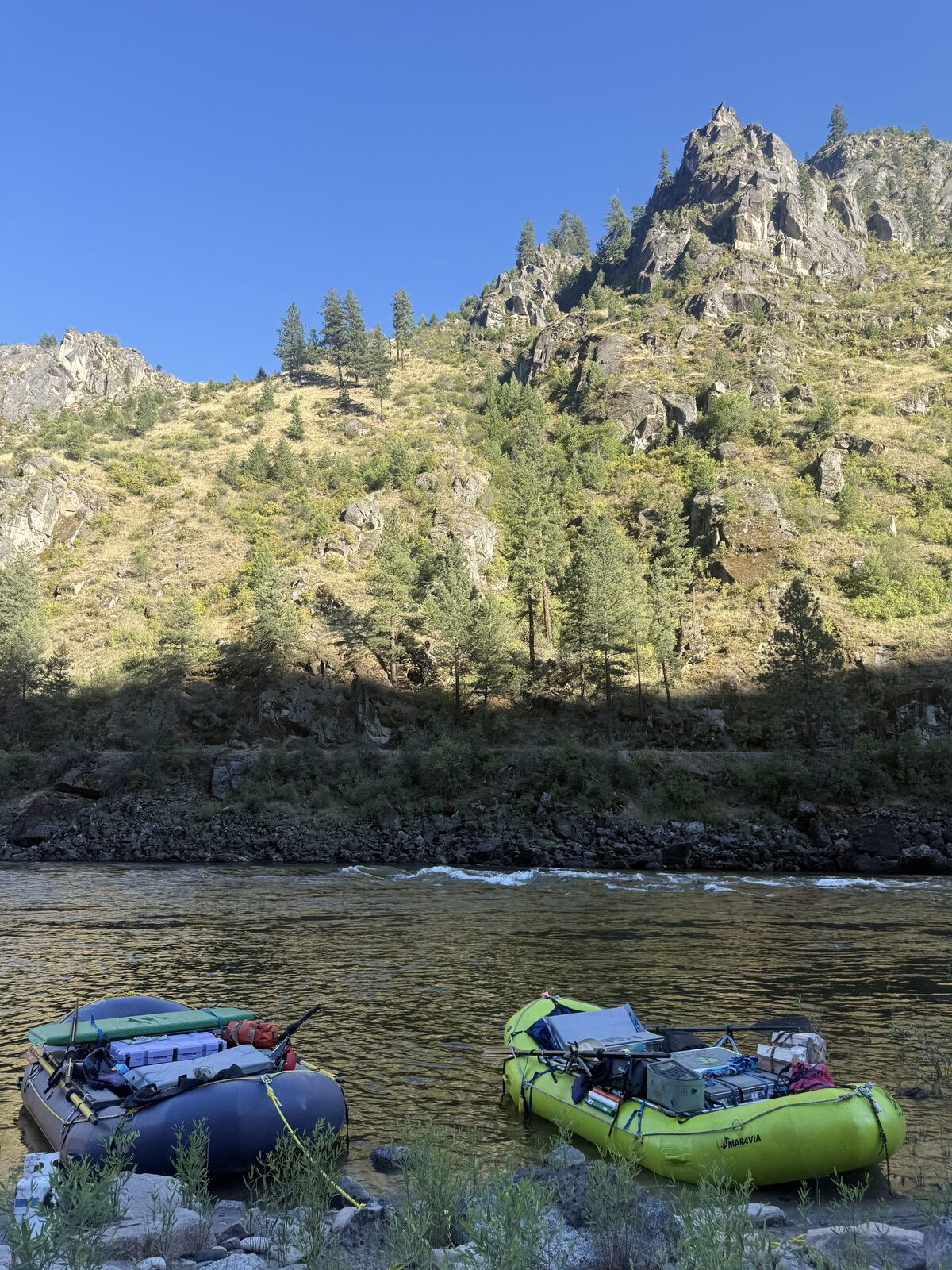 Two loaded rafts traveling the Salmon River through Idaho